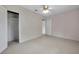 Spacious bedroom features an open closet and ceiling fan at 1665 Laura St, Clearwater, FL 33755