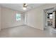 Bright bedroom with a ceiling fan and a view to the bathroom at 1665 Laura St, Clearwater, FL 33755