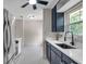 Renovated kitchen featuring stainless steel appliances and a view to the kitchen sink at 1665 Laura St, Clearwater, FL 33755