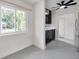 Bright kitchen features updated cabinets, stainless steel appliances and a ceiling fan at 1665 Laura St, Clearwater, FL 33755