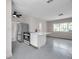 Modern kitchen with stainless steel refrigerator, oven, and an island with white countertop at 1665 Laura St, Clearwater, FL 33755