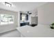 Well-lit kitchen with stainless steel appliances and quartz countertops at 1665 Laura St, Clearwater, FL 33755