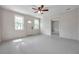 Bright living room with ceiling fan and view of the front entrance at 1665 Laura St, Clearwater, FL 33755