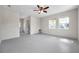 Bright and airy living room with lots of windows and access to the bathroom at 1665 Laura St, Clearwater, FL 33755