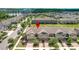 View of a new development showcasing multi-Gathering homes with tree lined streets and sidewalks at 16930 Red Brick Ln, Land O Lakes, FL 34638