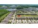 Aerial view of a new development community showcasing homes with landscaping and community ponds at 16930 Red Brick Ln, Land O Lakes, FL 34638