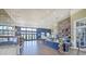 Beautiful resident cafe with coffee bar, multiple seating areas and plenty of natural light at 16930 Red Brick Ln, Land O Lakes, FL 34638