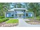 Community fitness center exterior with blue siding, white trim and professional landscaping at 16930 Red Brick Ln, Land O Lakes, FL 34638