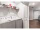 A practical laundry room includes a washer, dryer, and storage for laundry essentials at 16930 Red Brick Ln, Land O Lakes, FL 34638