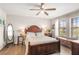 The main bedroom includes natural light, hardwood floors, and a large decorative mirror at 16930 Red Brick Ln, Land O Lakes, FL 34638