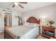 This main bedroom boasts hardwood floors, a large bed, and great access to a walk-in closet at 16930 Red Brick Ln, Land O Lakes, FL 34638