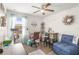 A bright office space with neutral walls and a ceiling fan offers a comfortable work environment at 16930 Red Brick Ln, Land O Lakes, FL 34638