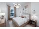 Inviting bedroom featuring natural light, soothing decor, and stylish accents at 17030 Moonflower Dr, Venice, FL 34293