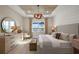 Comfortable bedroom with scenic water views, accent furniture, and wooden ceiling at 17030 Moonflower Dr, Venice, FL 34293