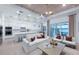 Bright and spacious living room seamlessly connected to the kitchen and dining area, with stunning water views at 17030 Moonflower Dr, Venice, FL 34293