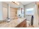 Bathroom featuring a granite countertop and tiled shower at 1859 Northview Rd, Largo, FL 33770