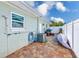 Exterior view with air conditioning system, white fence and a shower at 1859 Northview Rd, Largo, FL 33770