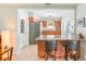 Well-appointed kitchen with wood cabinetry, granite countertops, and a convenient breakfast bar at 1859 Northview Rd, Largo, FL 33770