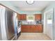 Bright kitchen with stainless steel appliances and classic wooden cabinetry at 1859 Northview Rd, Largo, FL 33770