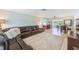 Inviting open-concept living room flowing into the kitchen and dining area with sliding glass doors at 1859 Northview Rd, Largo, FL 33770