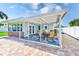 Relaxing covered patio features a dining area and is perfect for outdoor entertaining at 1859 Northview Rd, Largo, FL 33770