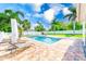 Enjoy outdoor living with a pristine pool, lounge chairs, and lush tropical surroundings at 1859 Northview Rd, Largo, FL 33770
