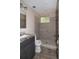 Updated bathroom featuring a walk-in shower with tile surround and granite countertop vanity at 1914 53Rd S St, Gulfport, FL 33707