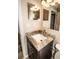 Bathroom vanity with granite countertop and undermount sink at 1914 53Rd S St, Gulfport, FL 33707