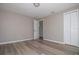 Bedroom with wood-look floors, neutral paint and closet at 1914 53Rd S St, Gulfport, FL 33707