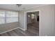 Hallway leading to the living spaces showcases wood-look flooring and neutral color palette at 1914 53Rd S St, Gulfport, FL 33707