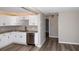Updated kitchen with white cabinets, stainless steel appliances, granite countertops, stylish subway tile backsplash, and new flooring at 1914 53Rd S St, Gulfport, FL 33707