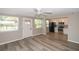 Bright living space featuring new flooring, neutral walls, and a view into the updated kitchen with stainless steel appliances at 1914 53Rd S St, Gulfport, FL 33707