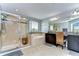 Bright bathroom featuring a glass shower, a tub and a large vanity at 19533 Whispering Brook Dr, Tampa, FL 33647