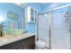 Stylish bathroom featuring a glass vessel sink, granite countertop, and a modern glass-enclosed shower at 19533 Whispering Brook Dr, Tampa, FL 33647