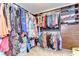 Large walk-in closet with custom shelves and lots of storage space at 19533 Whispering Brook Dr, Tampa, FL 33647