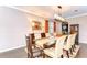 Stylish dining room with a long table, comfortable seating, and sophisticated decor at 19533 Whispering Brook Dr, Tampa, FL 33647