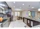 Open concept kitchen with dark cabinets, a center island, and an adjacent dining area at 19533 Whispering Brook Dr, Tampa, FL 33647