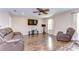 Inviting living room with wood floors, comfortable seating, and ample natural light at 19533 Whispering Brook Dr, Tampa, FL 33647