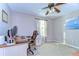 Home office with a ceiling fan, a large desk, and a comfortable executive chair at 19533 Whispering Brook Dr, Tampa, FL 33647