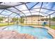 Inviting screened-in pool area with a clear blue pool at 19533 Whispering Brook Dr, Tampa, FL 33647