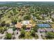 Aerial view highlights the golf course, pool, and tennis courts, offering premier amenities at 2212 Lark W Cir # E, Palm Harbor, FL 34684
