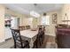 Elegant dining area featuring a chandelier and stylish decor at 2212 Lark W Cir # E, Palm Harbor, FL 34684