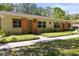 Charming one-story home with a well-maintained lawn and cozy front porch at 2212 Lark W Cir # E, Palm Harbor, FL 34684
