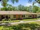 Charming single-story home with manicured lawn and mature trees at 2212 Lark W Cir # E, Palm Harbor, FL 34684