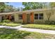 Charming single-story home with lush front yard landscaping at 2212 Lark W Cir # E, Palm Harbor, FL 34684