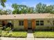 Inviting single-story home with tidy landscaping and covered front porch at 2212 Lark W Cir # E, Palm Harbor, FL 34684