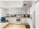 Bright kitchen featuring white cabinets, and a view of the backyard at 2212 Lark W Cir # E, Palm Harbor, FL 34684