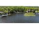 Picturesque lake view with docks and greenery, great for tranquil moments on the water at 2212 Lark W Cir # E, Palm Harbor, FL 34684