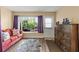 Inviting living room with hardwood floors and a view of the outdoors at 2212 Lark W Cir # E, Palm Harbor, FL 34684