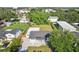 Aerial view of a house with a large backyard, complete with lush greenery and a detached shed at 2288 Cheryl Rd, Largo, FL 33771
